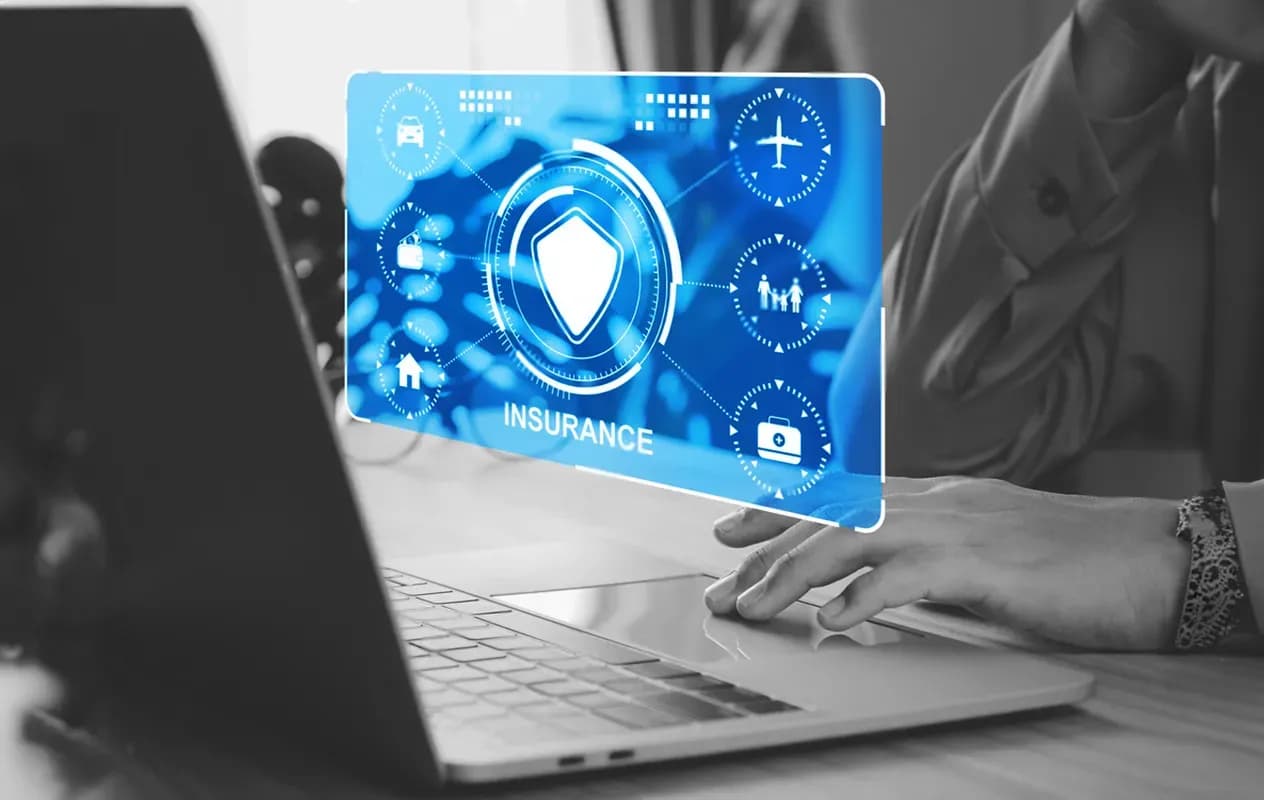 A person using laptop while a blue gradient image showing different elements of the insurance are portrayed. 